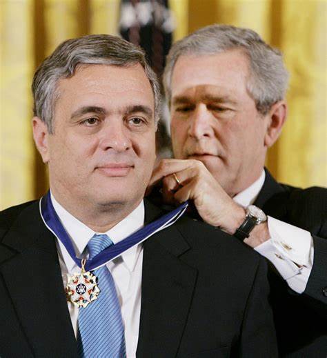 Two men in suits

Description automatically generated with low confidence