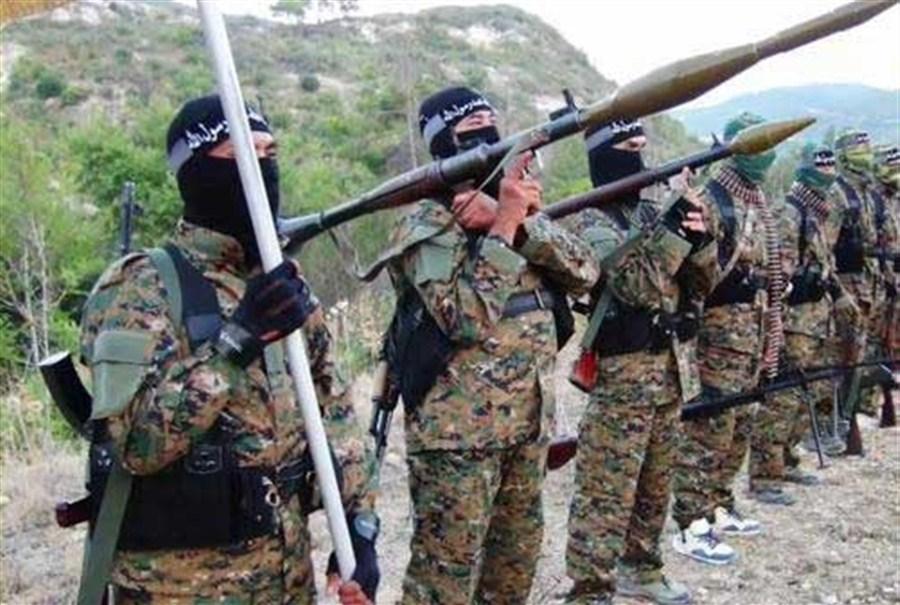 A group of soldiers holding guns
Description automatically generated with low confidence