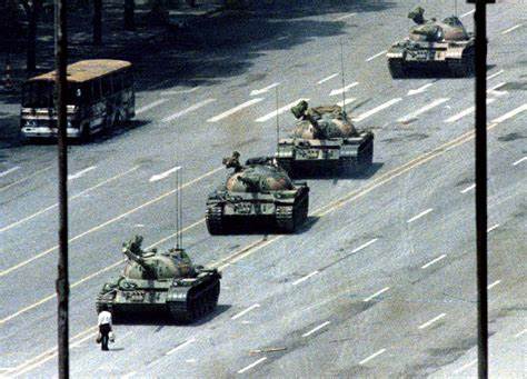 A group of tanks driving down a street

Description automatically generated with medium confidence