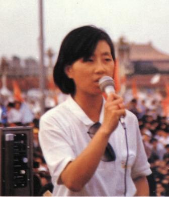 A person holding a microphone

Description automatically generated with medium confidence