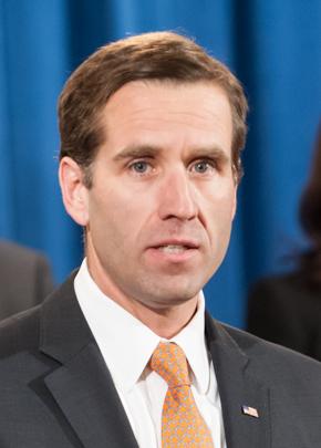 A person in a suit and tie

Description automatically generated with medium confidence