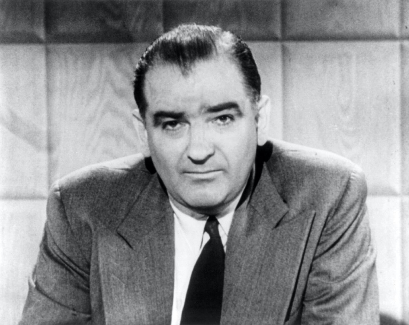 A person in a suit and tie
Description automatically generated with medium confidence