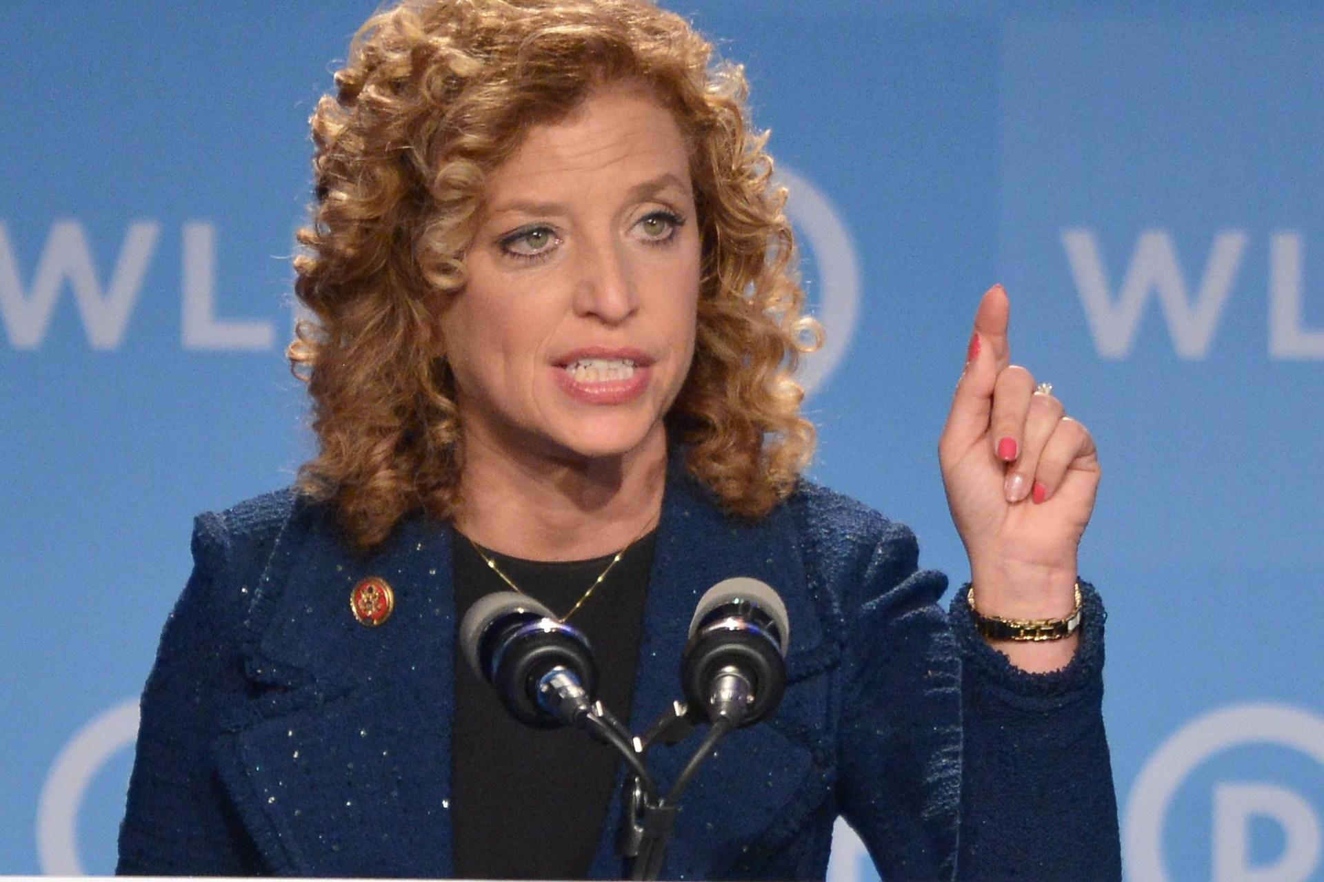 A person speaking into microphones
Description automatically generated with low confidence