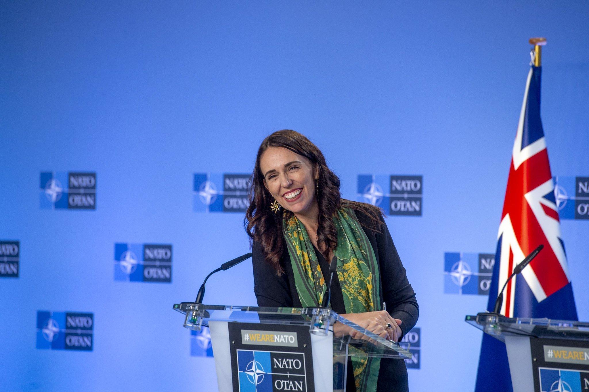A person standing at a podium

Description automatically generated