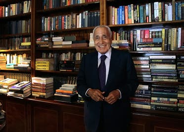 In this Sept. 23, 2014 photo, Mohamed Heikal poses for a picture on his 91st birthday, at his office, in Cairo, Egypt. AP