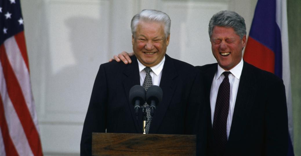 A couple of men standing at a podium

Description automatically generated with low confidence