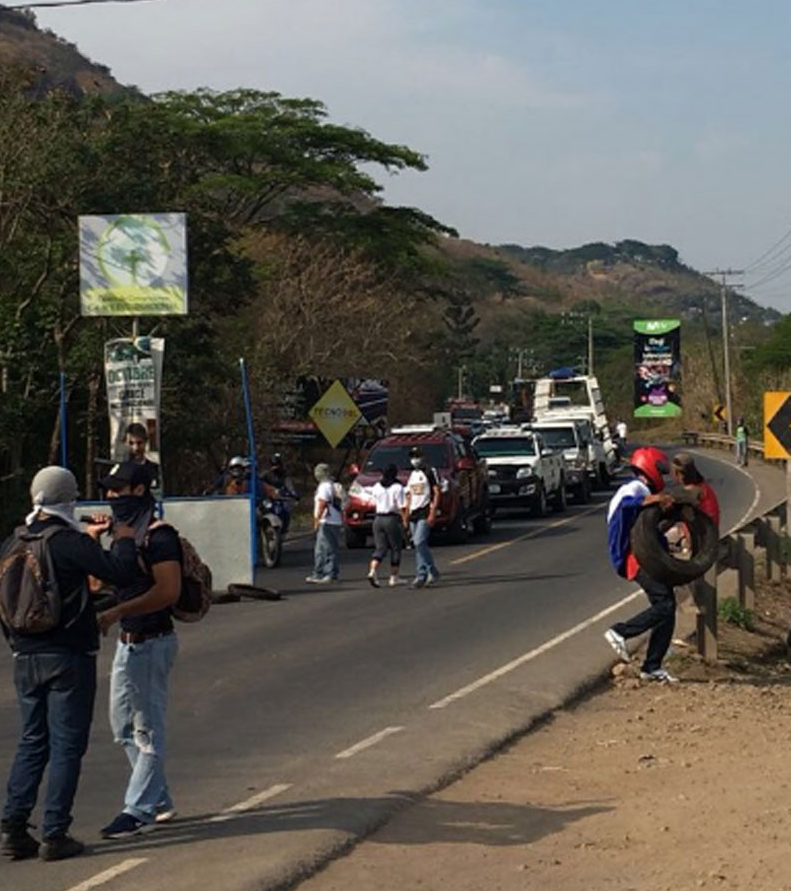 A group of people on a road

Description automatically generated