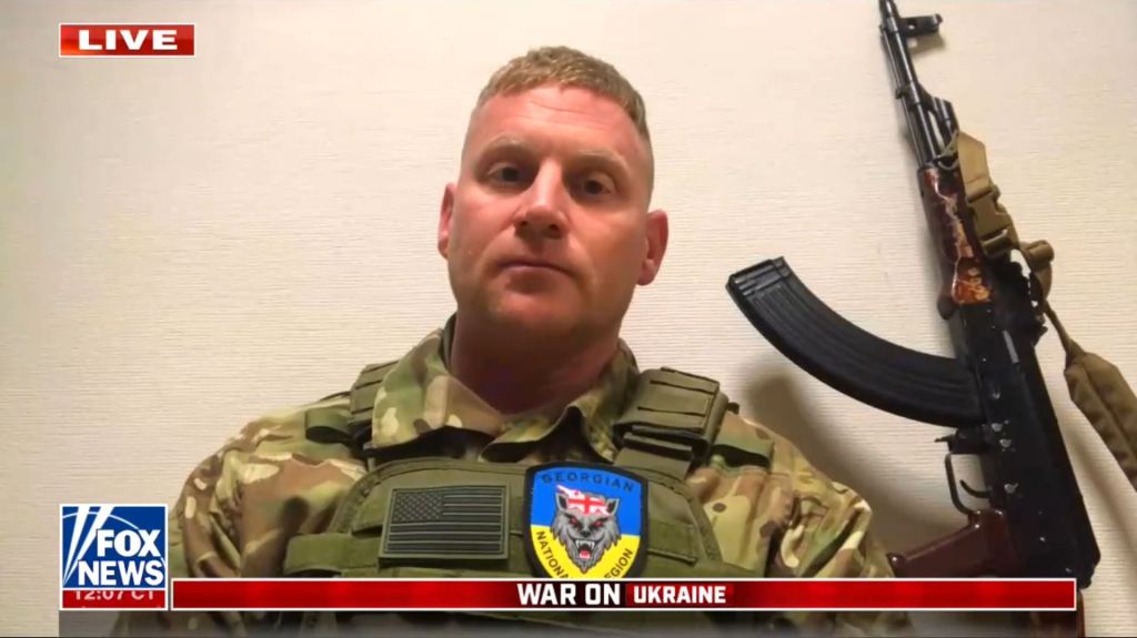 A person in a military uniform

Description automatically generated with medium confidence