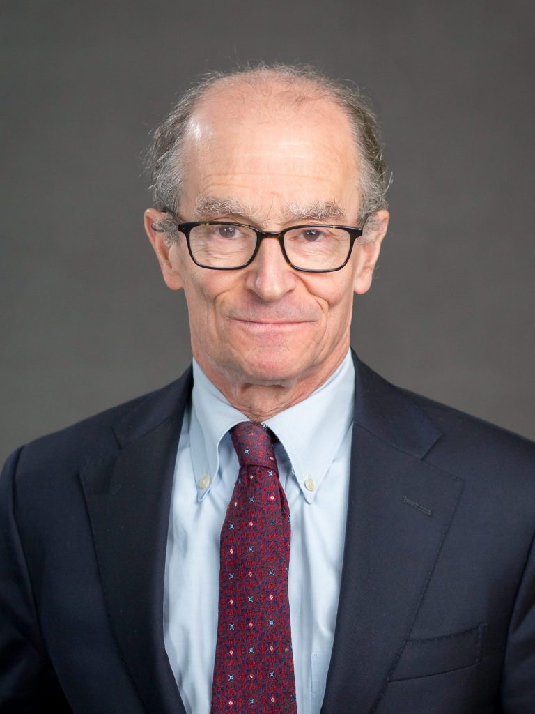 A person in a suit and tie

Description automatically generated with medium confidence