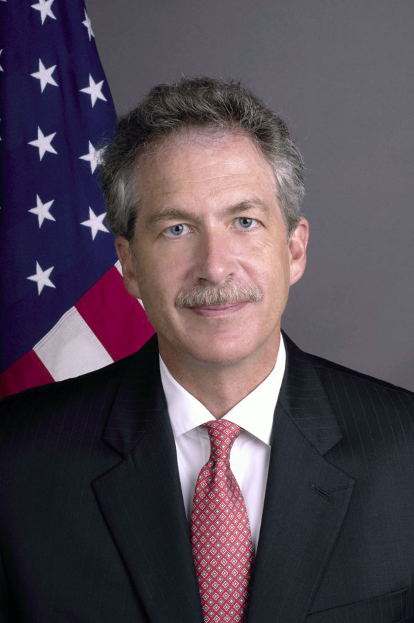 A person in a suit and tie

Description automatically generated with medium confidence