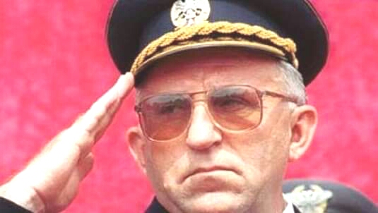 A person in a uniform saluting

Description automatically generated with medium confidence