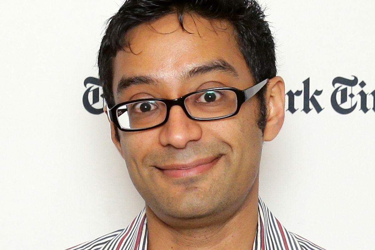 A person wearing glasses and smiling

Description automatically generated with low confidence