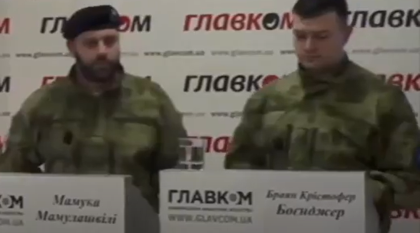 Two men in military uniforms

Description automatically generated with low confidence