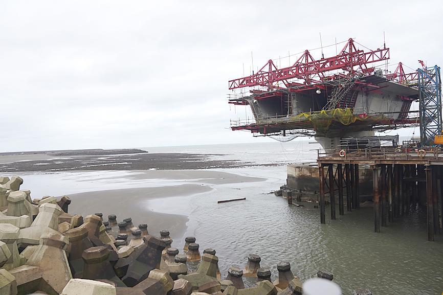 A construction site on a beach
Description automatically generated