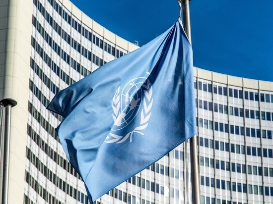 A flag flying in front of a building

Description automatically generated with low confidence