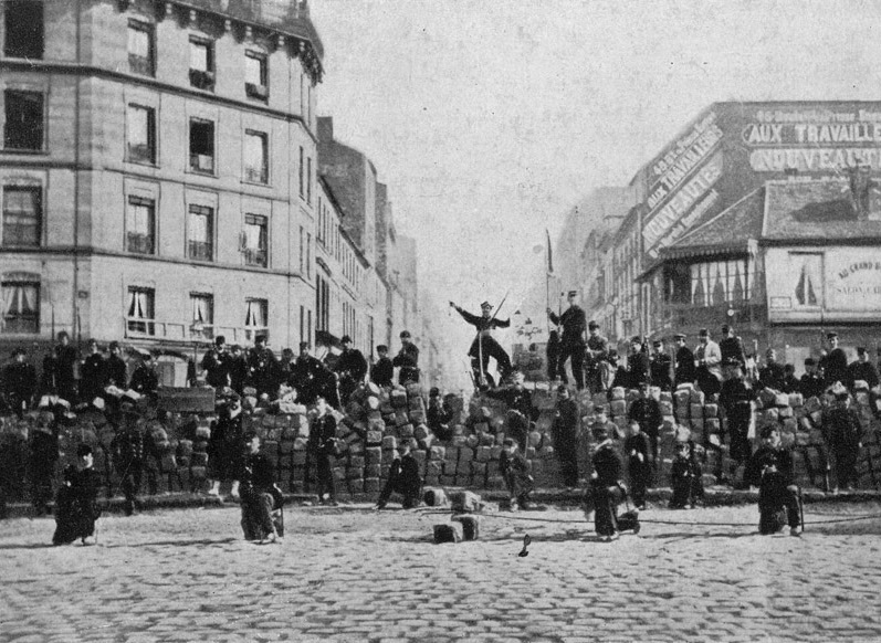 A group of people playing in the street Description automatically generated