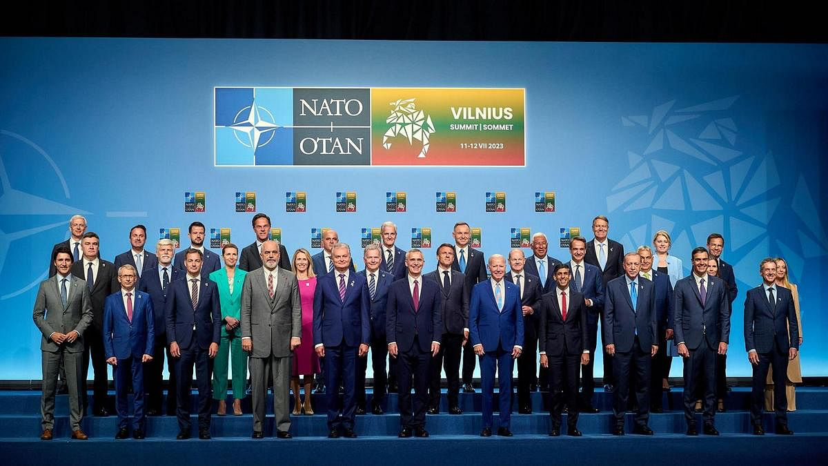 A group of people standing on a stage

Description automatically generated