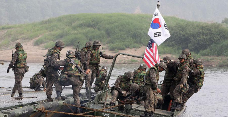 A group of soldiers on a boat

Description automatically generated