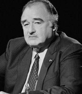 A person in a suit and tie
Description automatically generated with medium confidence