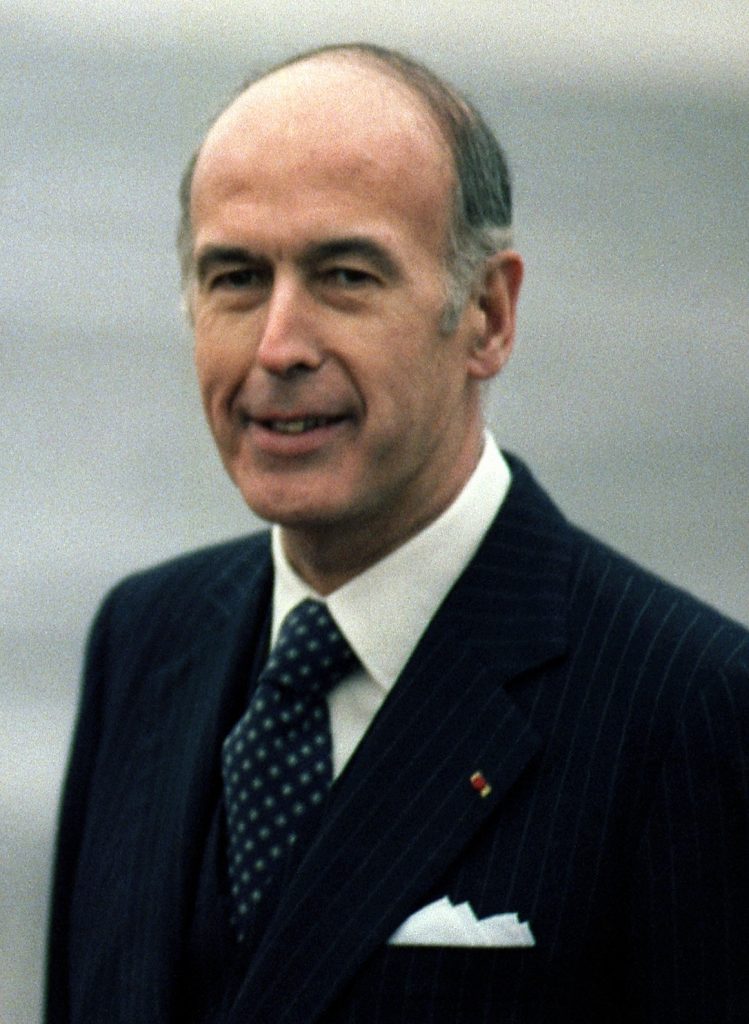 A person in a suit and tie
Description automatically generated with medium confidence
