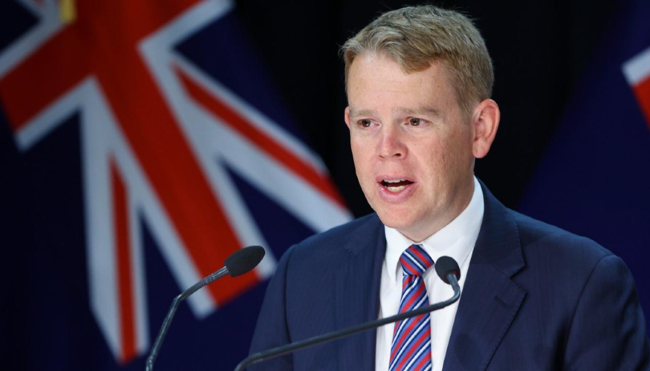 A person in a suit speaking into a microphone

Description automatically generated with medium confidence