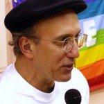 A person wearing a hat and glasses
Description automatically generated