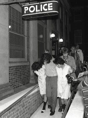 In 1981, Brinks heist suspects Kathy Boudin, David Gilbert and Judith Clark are led from Nyack police headquarters after arraignment on murder charges.