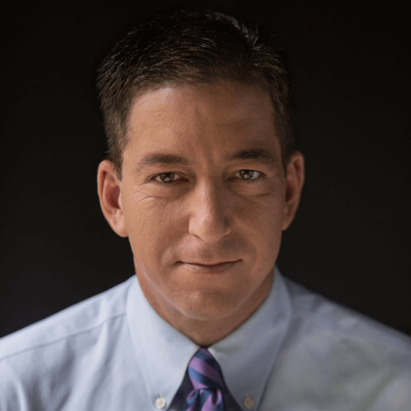 A person in a blue shirt and purple tie

Description automatically generated