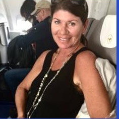 A person sitting on an airplane

Description automatically generated