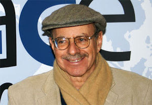 A person wearing a hat and scarf
Description automatically generated