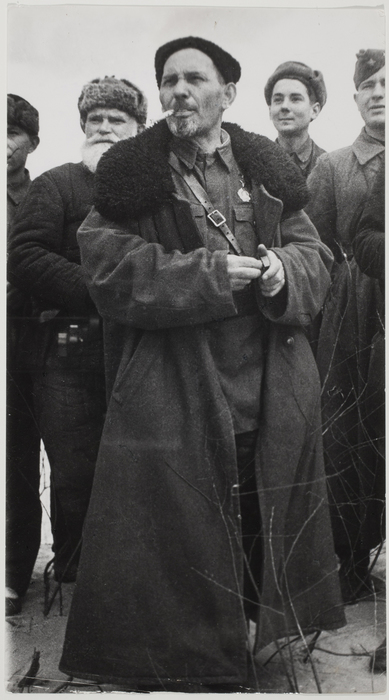 A person wearing a large coat Description automatically generated