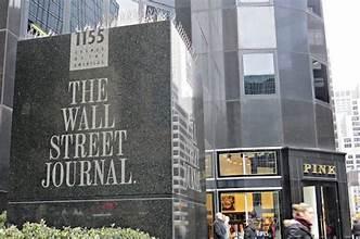 A building with a sign on it

Description automatically generated