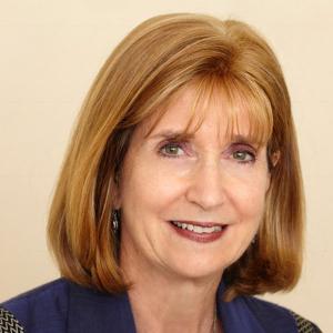 A close-up of a person smiling
Description automatically generated