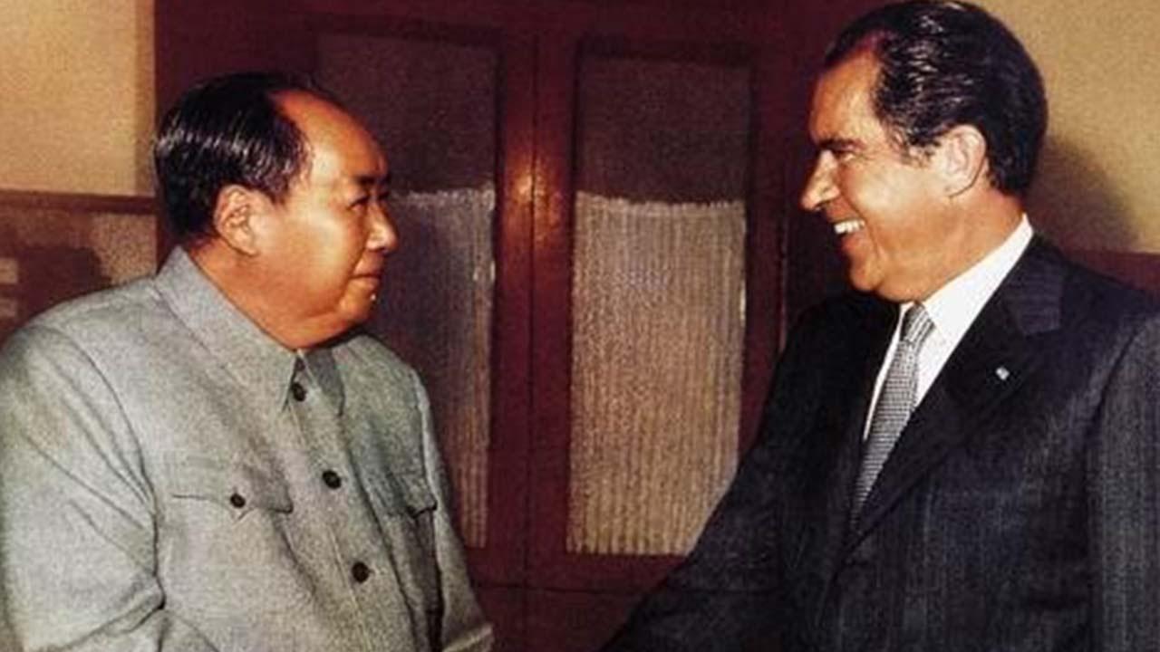 A close-up of men shaking hands
Description automatically generated