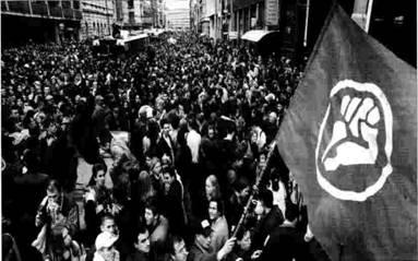 A crowd of people in a street
Description automatically generated