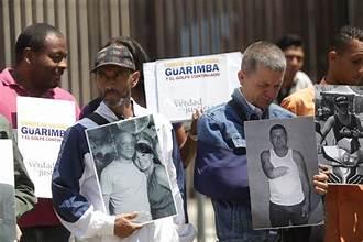 A group of people holding signs
Description automatically generated
