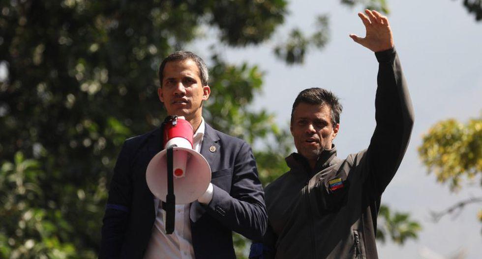 A person holding a megaphone and raising his hand
Description automatically generated