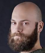 A person with a beard
Description automatically generated