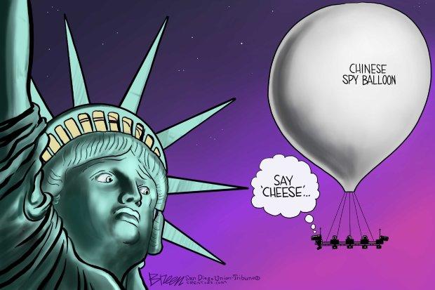 A statue of liberty and a balloon
Description automatically generated