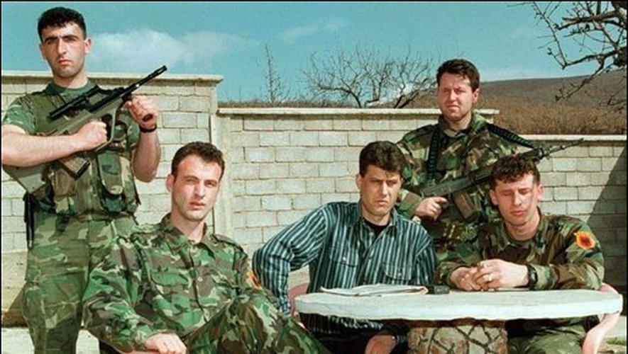 A group of men in military uniforms
Description automatically generated