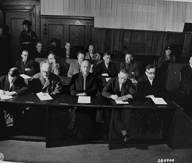 A group of people sitting at a table
Description automatically generated