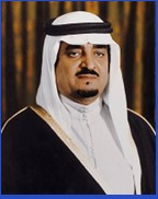 A person in a black and white headdress
Description automatically generated