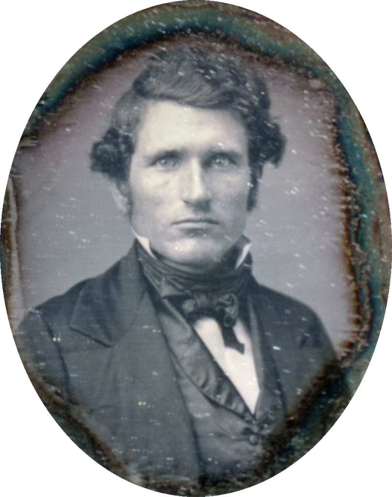 A person in a suit
Description automatically generated