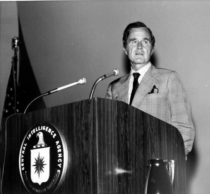 A person standing at a podium

Description automatically generated with medium confidence