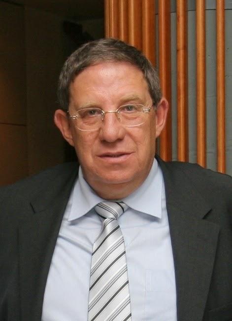 A person wearing a suit and tie
Description automatically generated