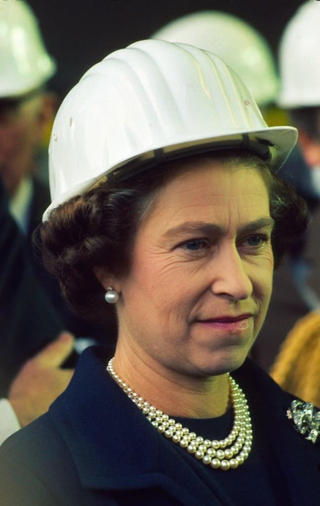 A person wearing a white hard hat
Description automatically generated