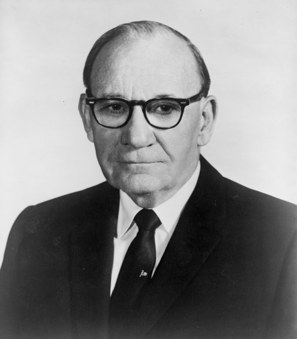 A person wearing glasses and a suit

Description automatically generated with medium confidence