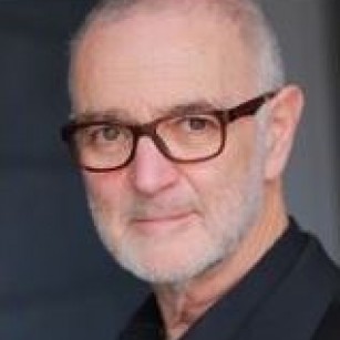 A person with glasses and a beard

Description automatically generated