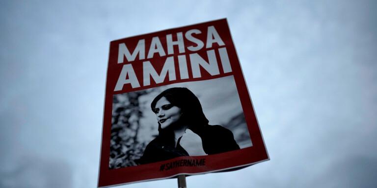 A red and white sign with a person on it

Description automatically generated