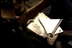 An officer holding papers.